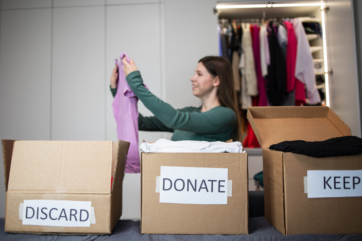 boxes labeled for decluttering: discard, donate, keep