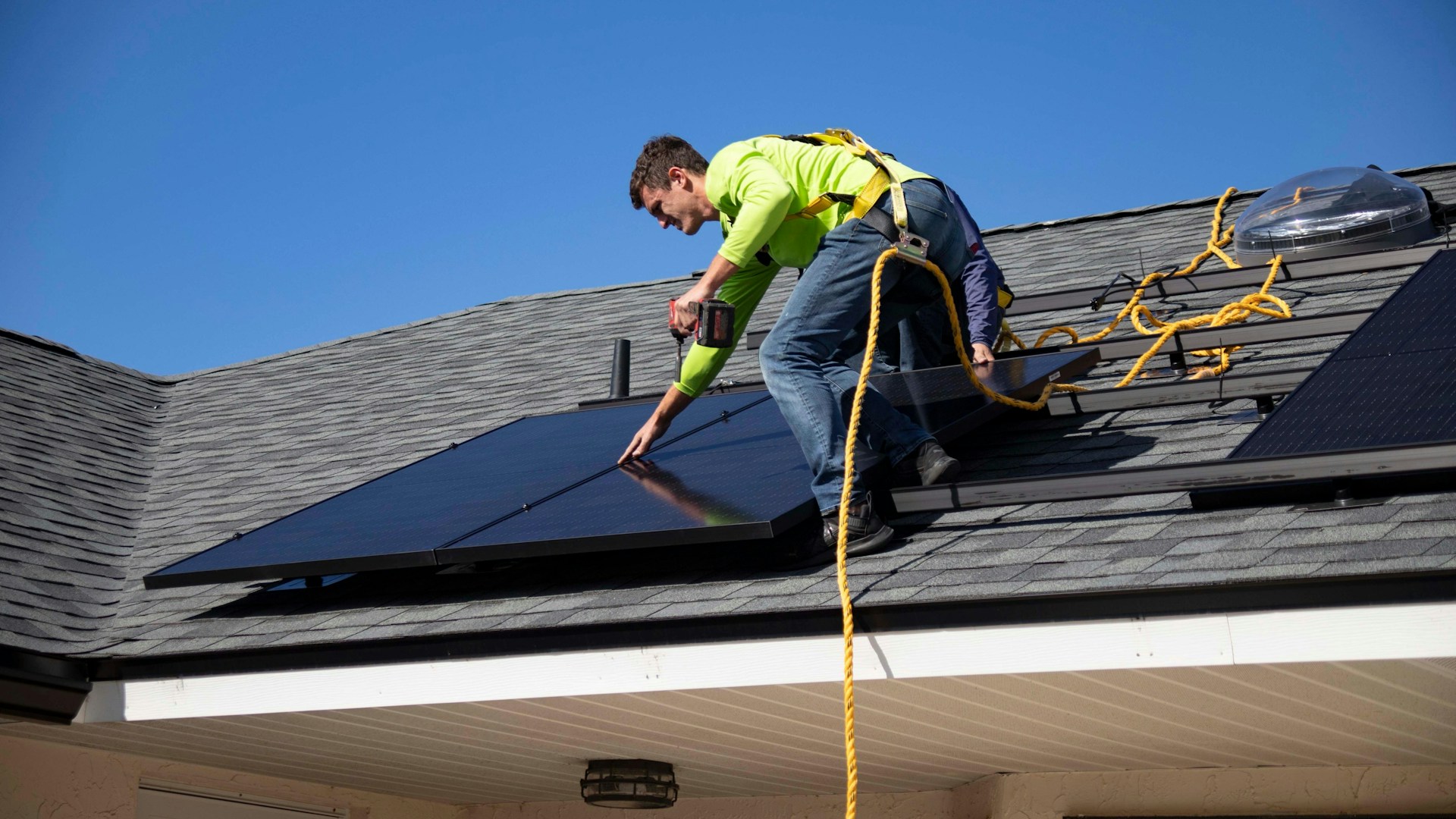 person installing solar panels