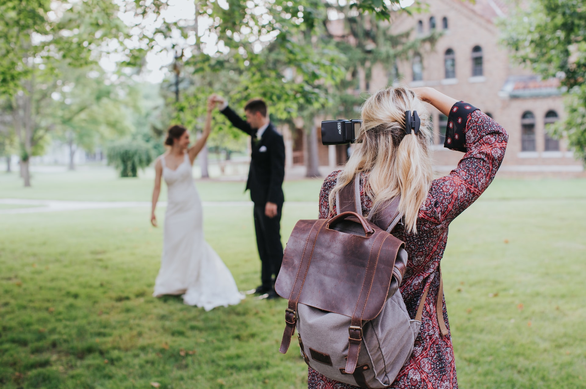 Photographer taking pictures of a couple at a wedding