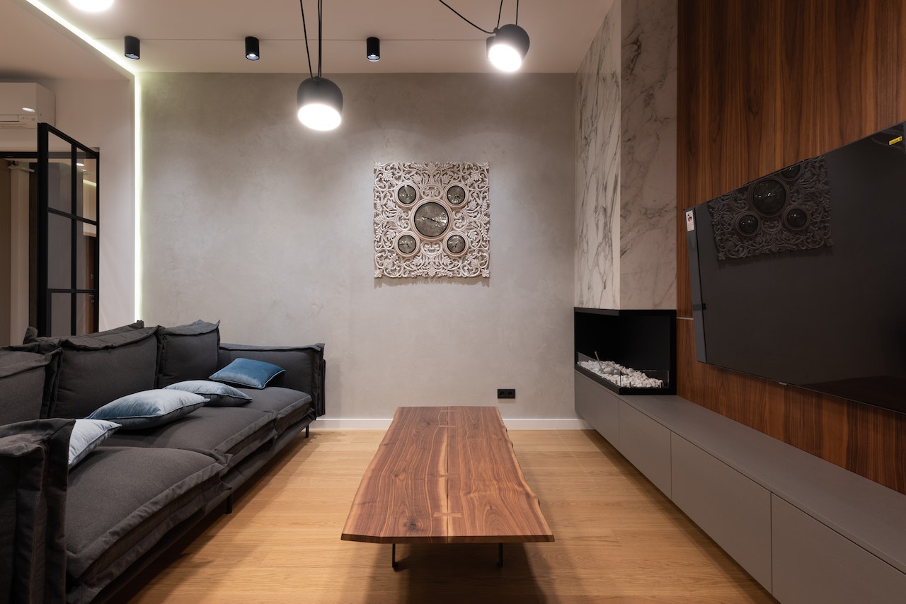 livingroom, sofa, wood table, tv on wall