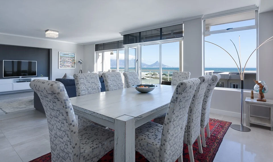 diningroom, livingroom, large windows facing the ocean and mountians