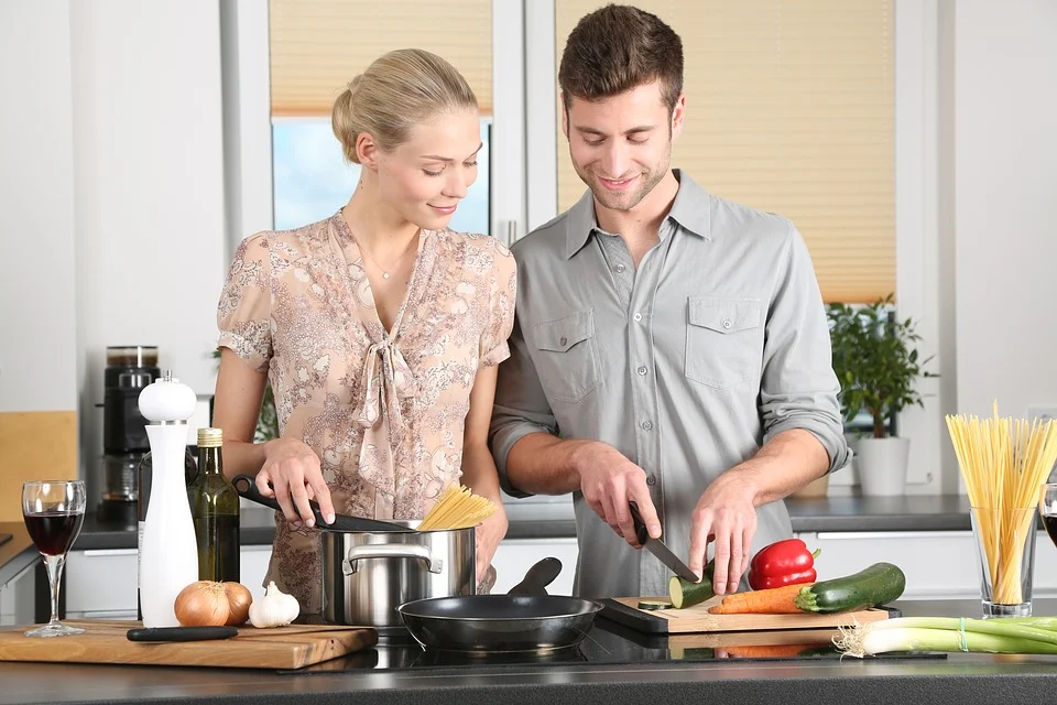 Two people cooking together