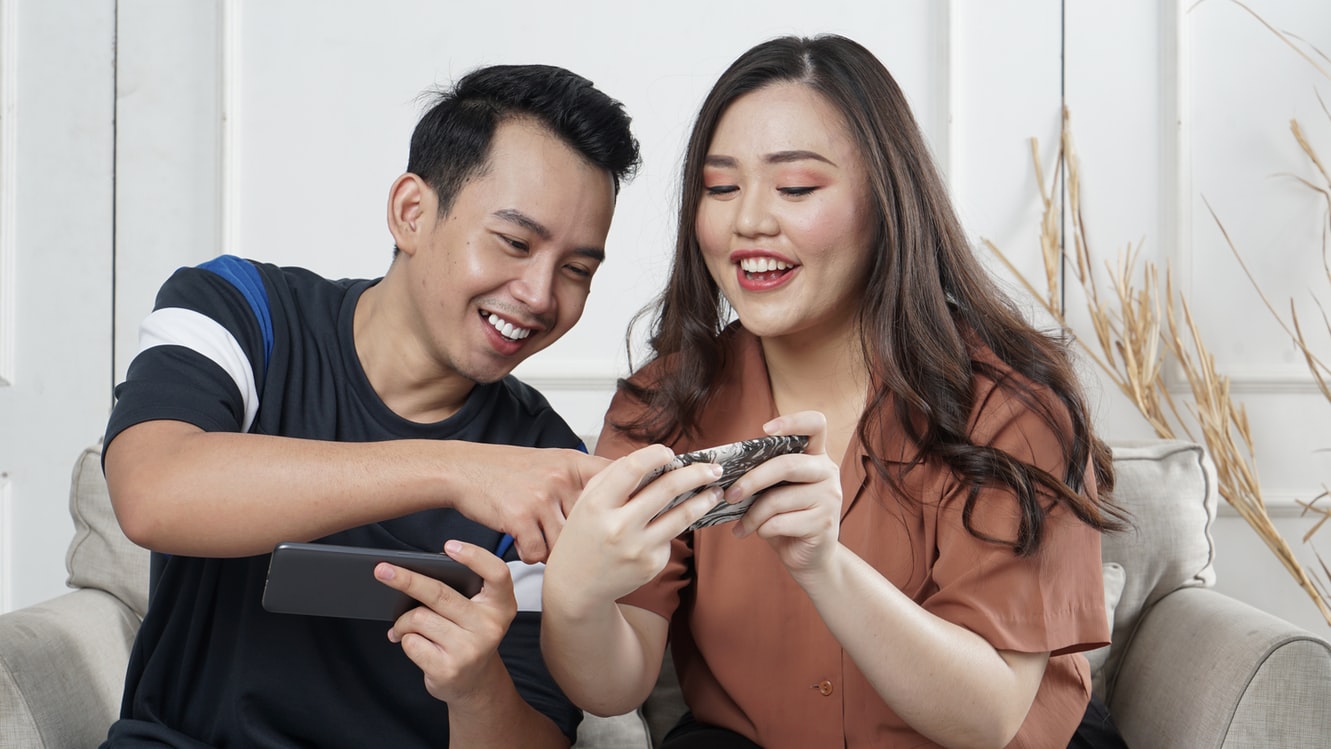 two people on their cellphones.