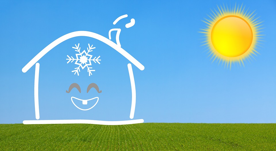 cartoon sun and house with a snowflake