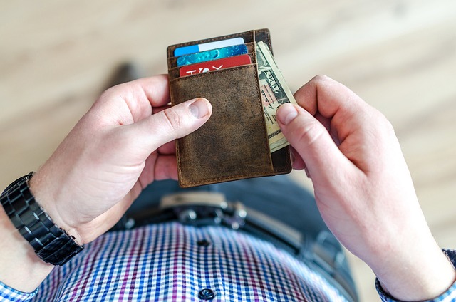 Money and credit cards in a wallet
