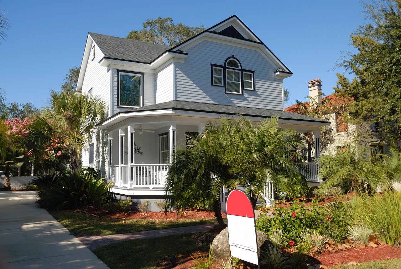 white house with a large porch