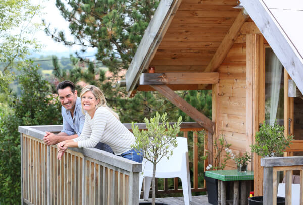 2 people standing on a deck