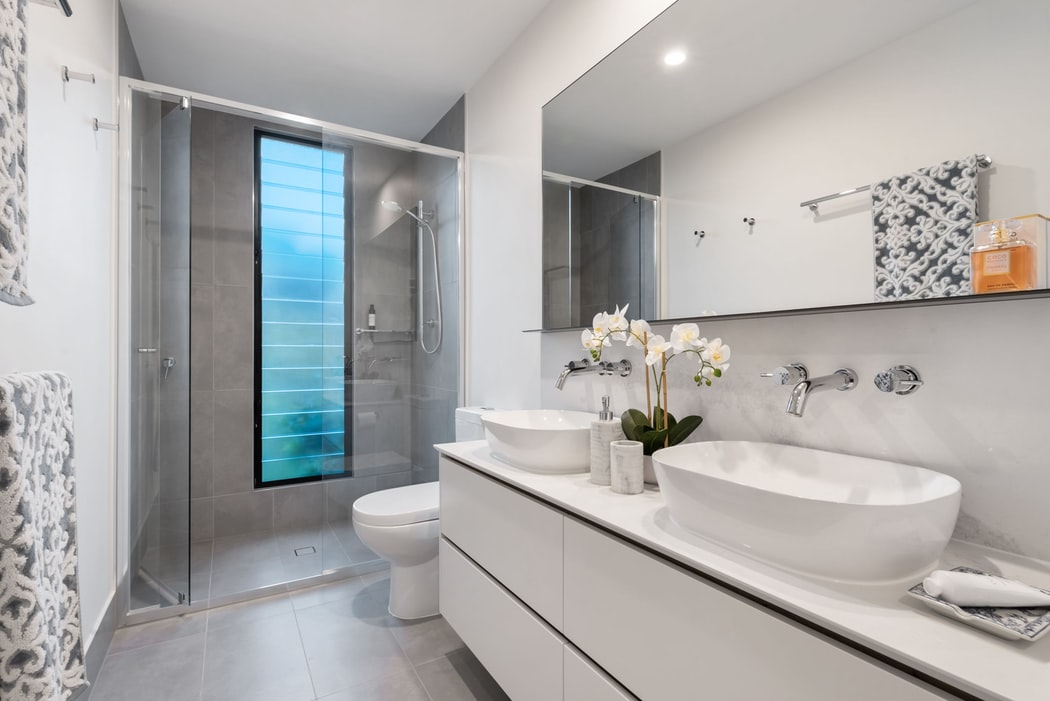 Bathroom with double sink vanities