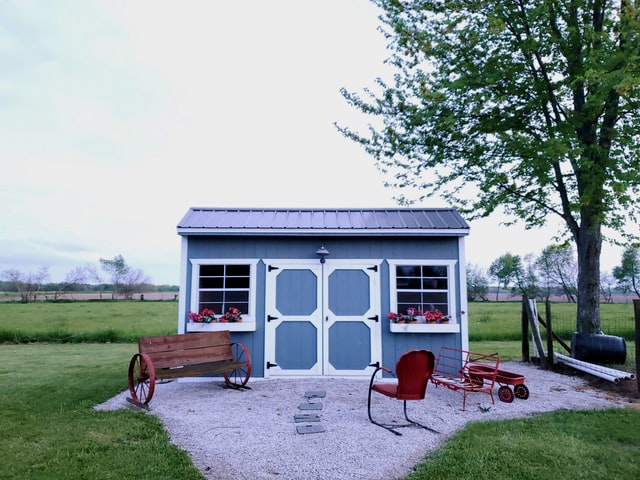 Blue storage shed, white trim