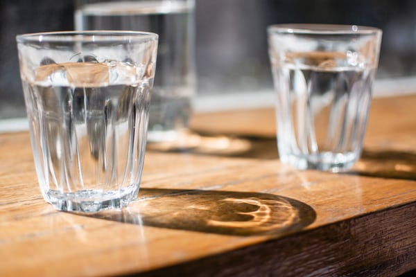 3 glasses of water on a table