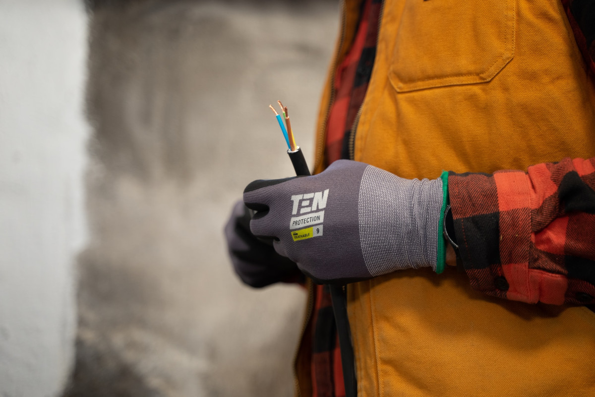 electrician with wires in his hands