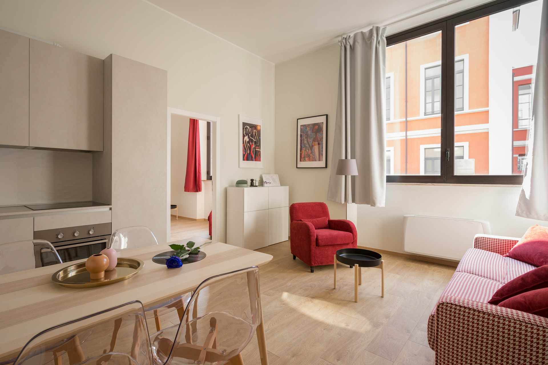 Tidy modern apartment living room with furniture and a wall-mounted air conditioning unit. Image via Unsplash