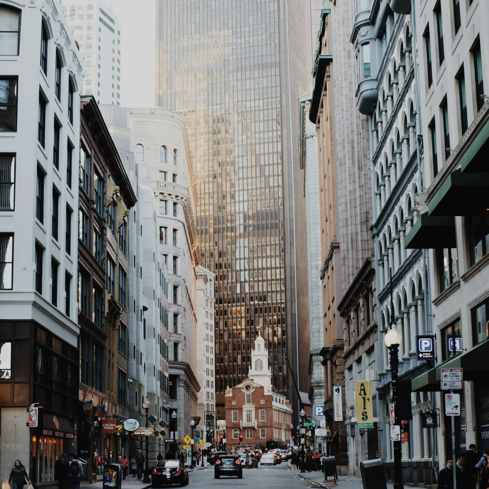 eople walking down the street in Boston. Image by Unsplash