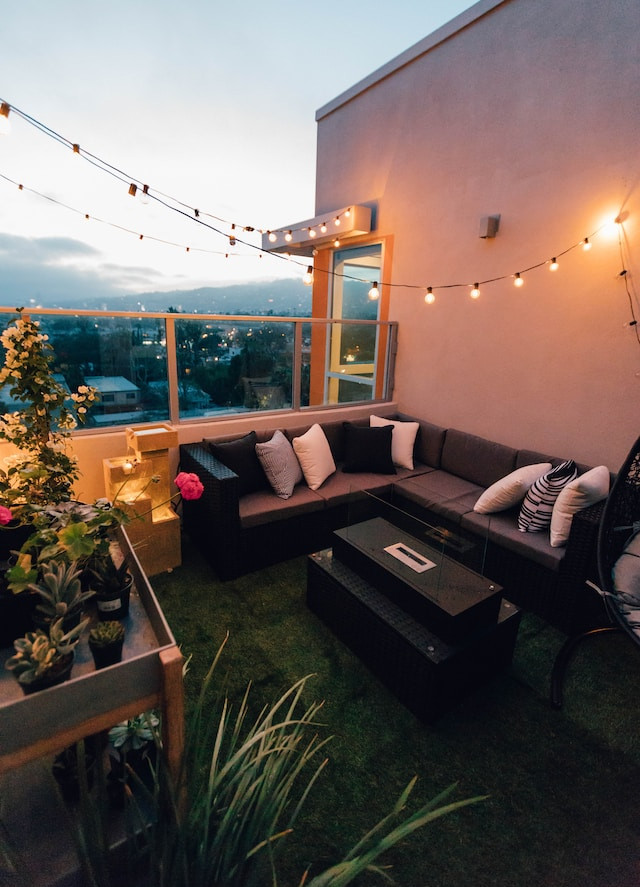 balcony with lights, furniture, plants