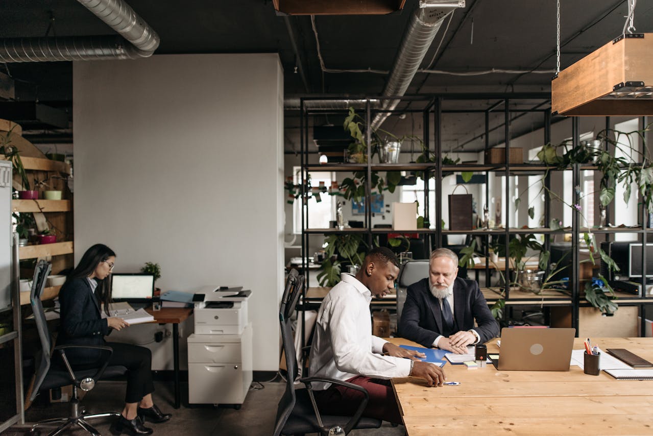 People working in an office. Image by Pexels