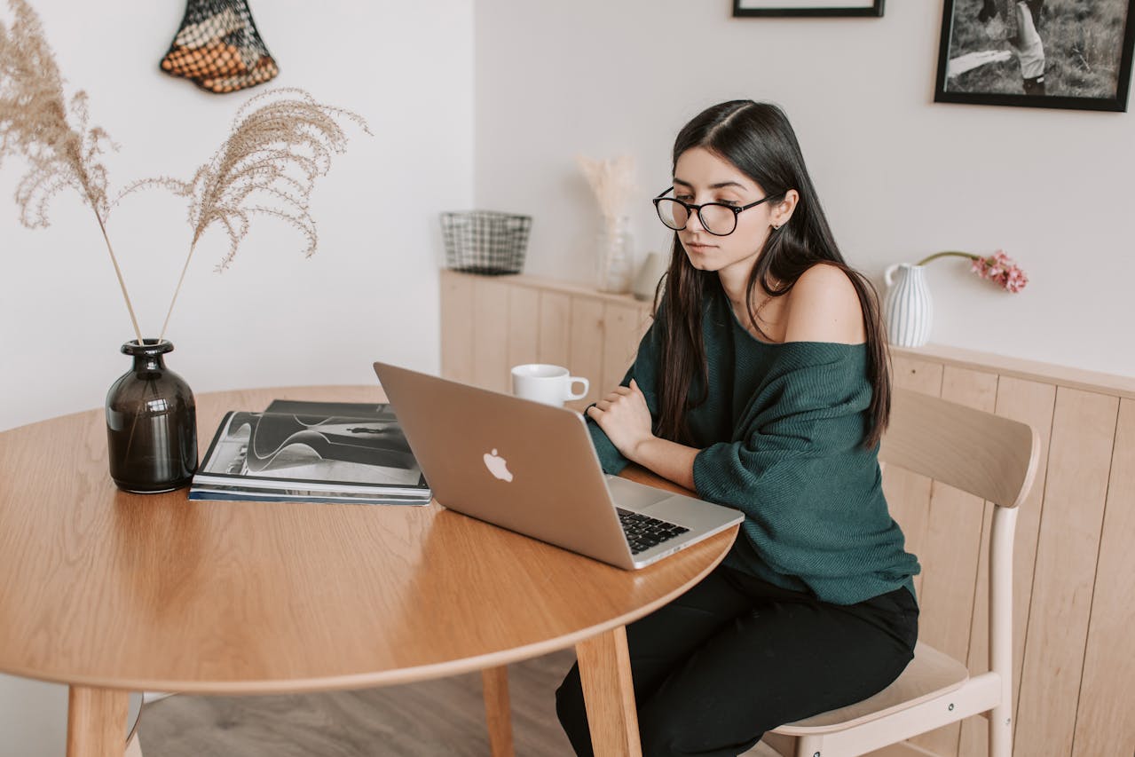 Freelancer watching laptop on a table. Image by Pexels