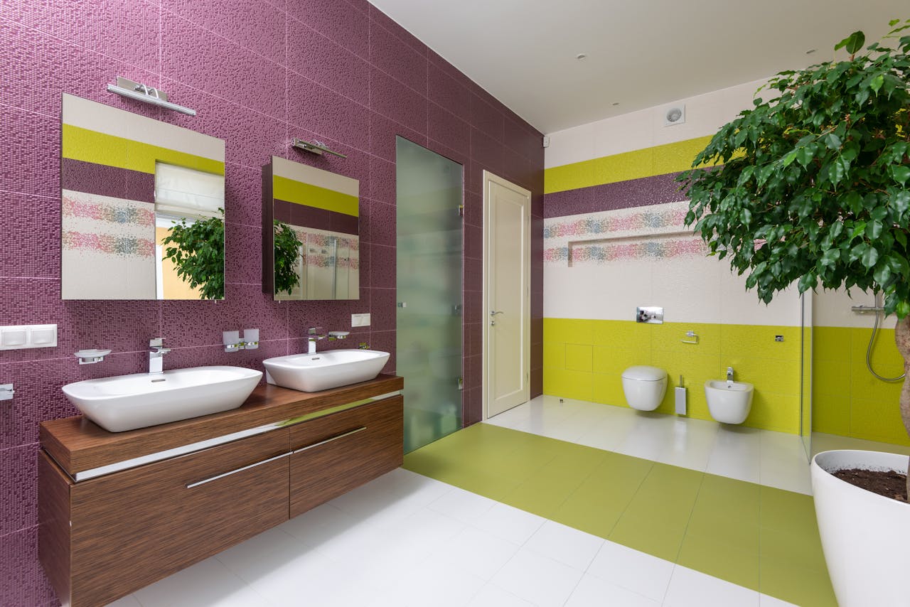 Bathroom with purple and green walls. Image by Pexels