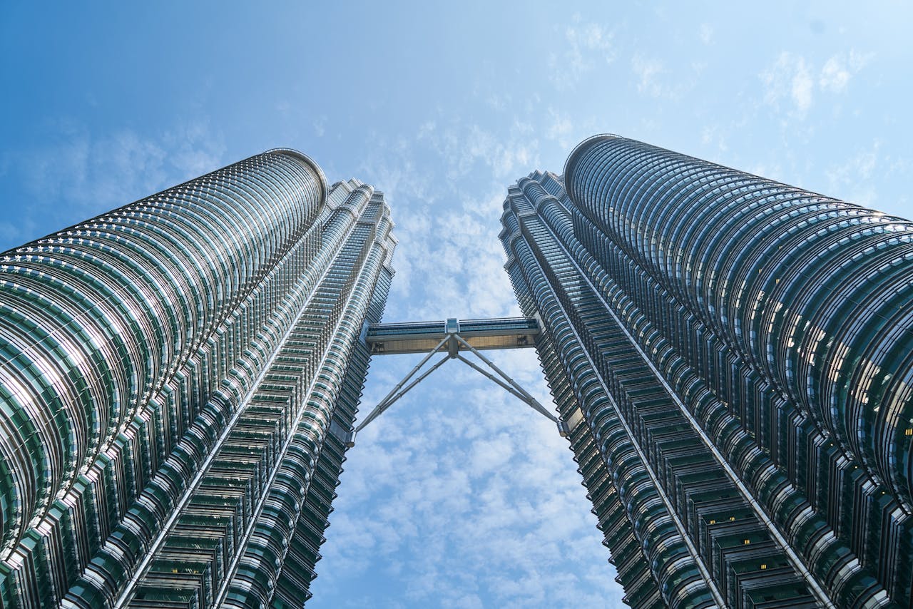 Low angle image of twin tower. Image by Pexels