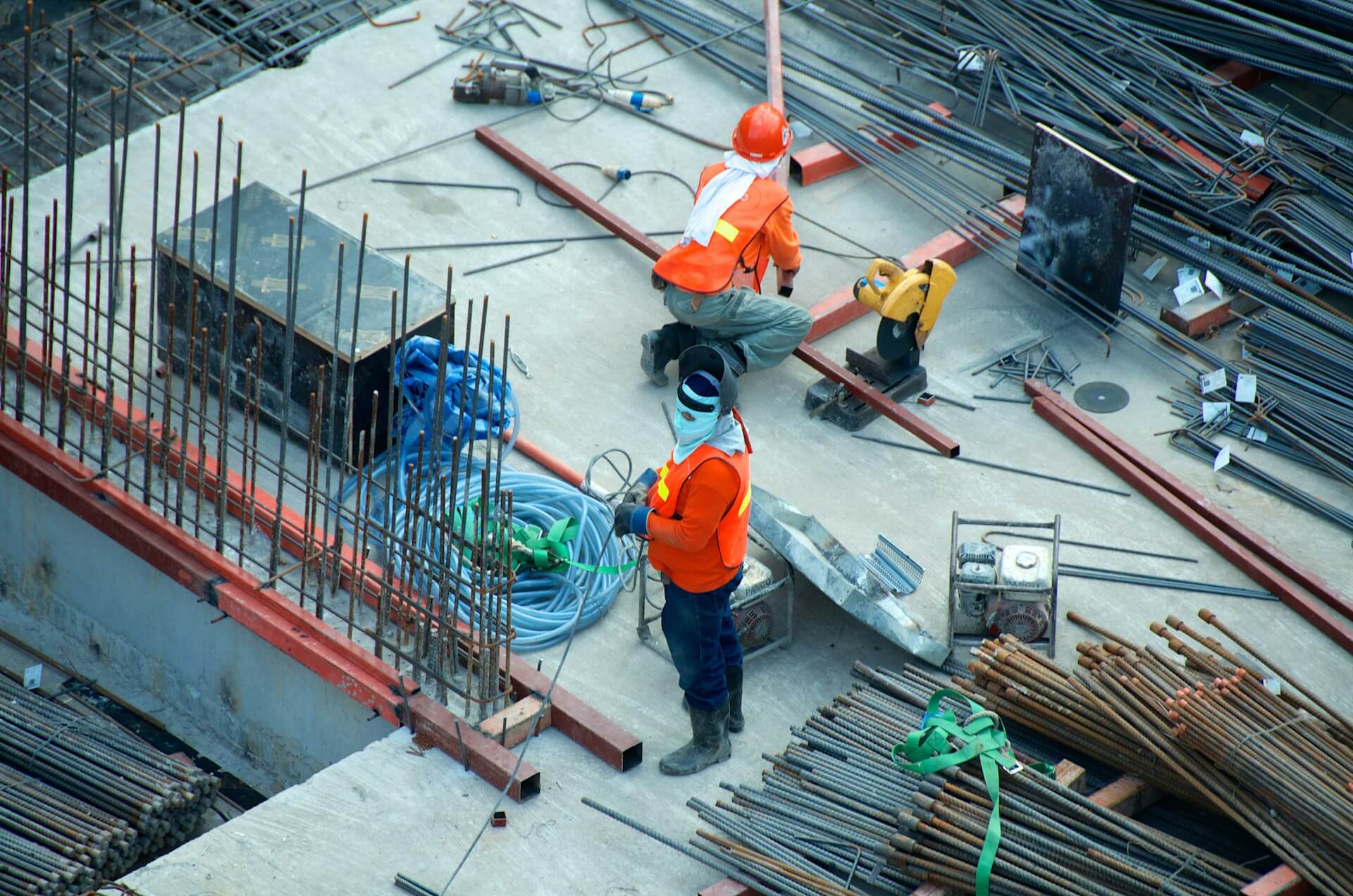 Two people working at a contrcution site. Image by Unsplash