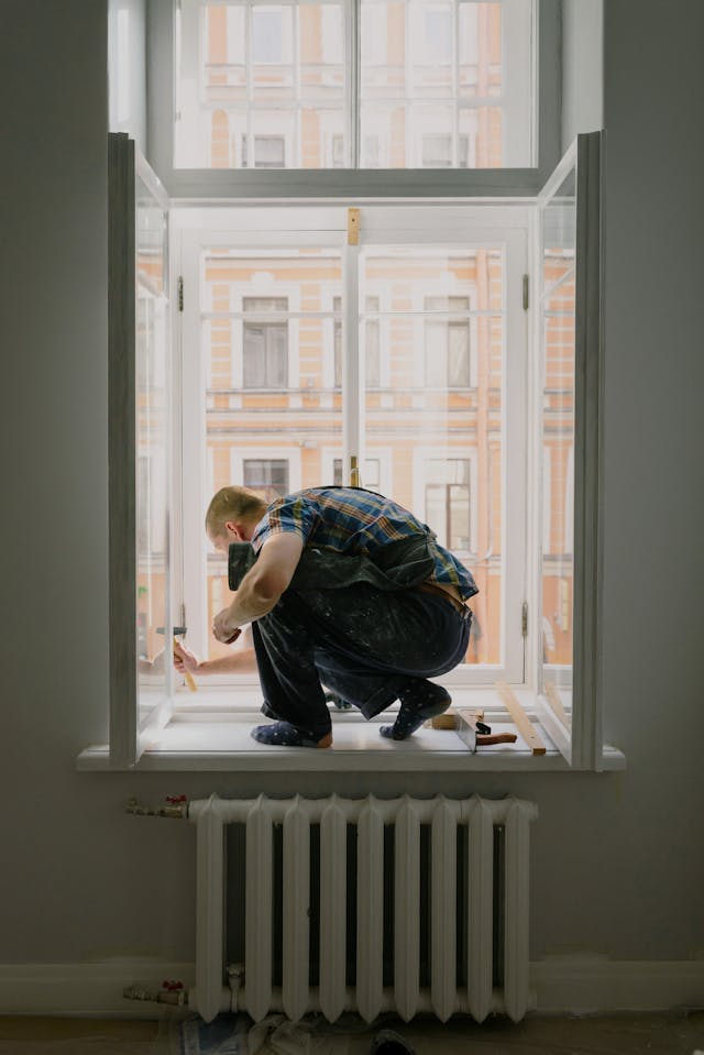 Person doing work on a window