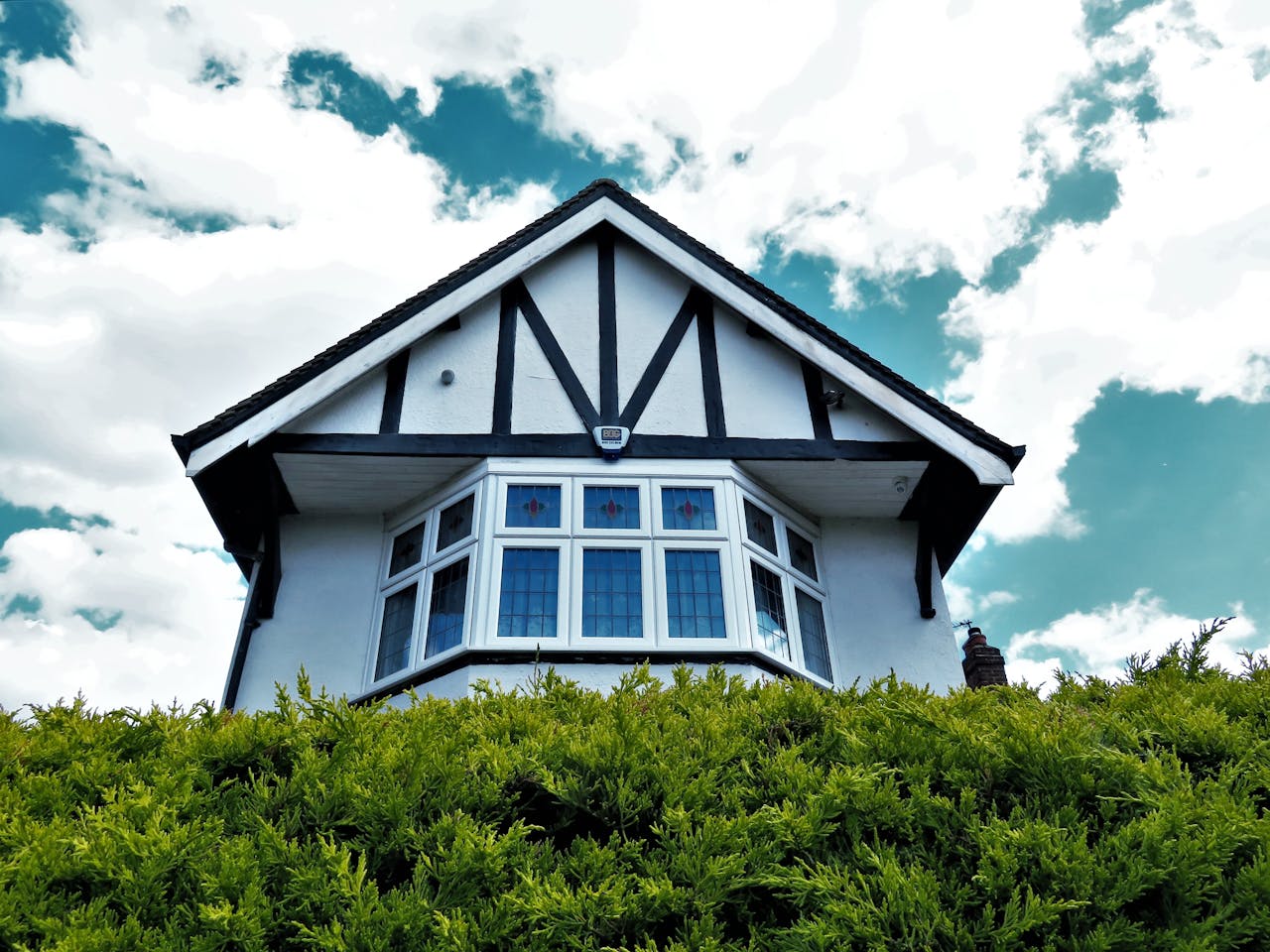 Low angle photo of a modern custom home addition during daytime showing premium construction and design. Image by Pexels