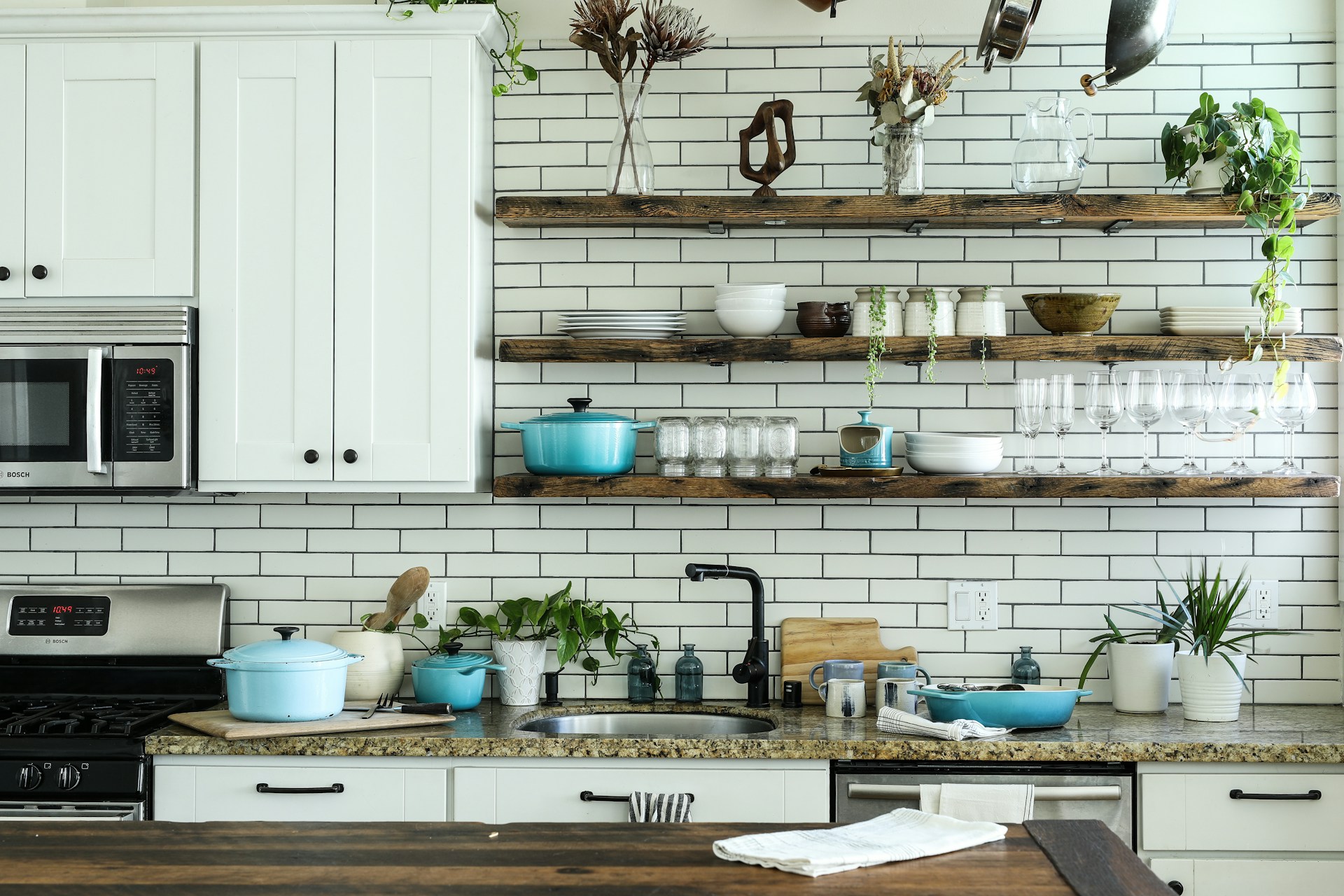 Bright modern compact urban kitchen with open shelving and clean layout