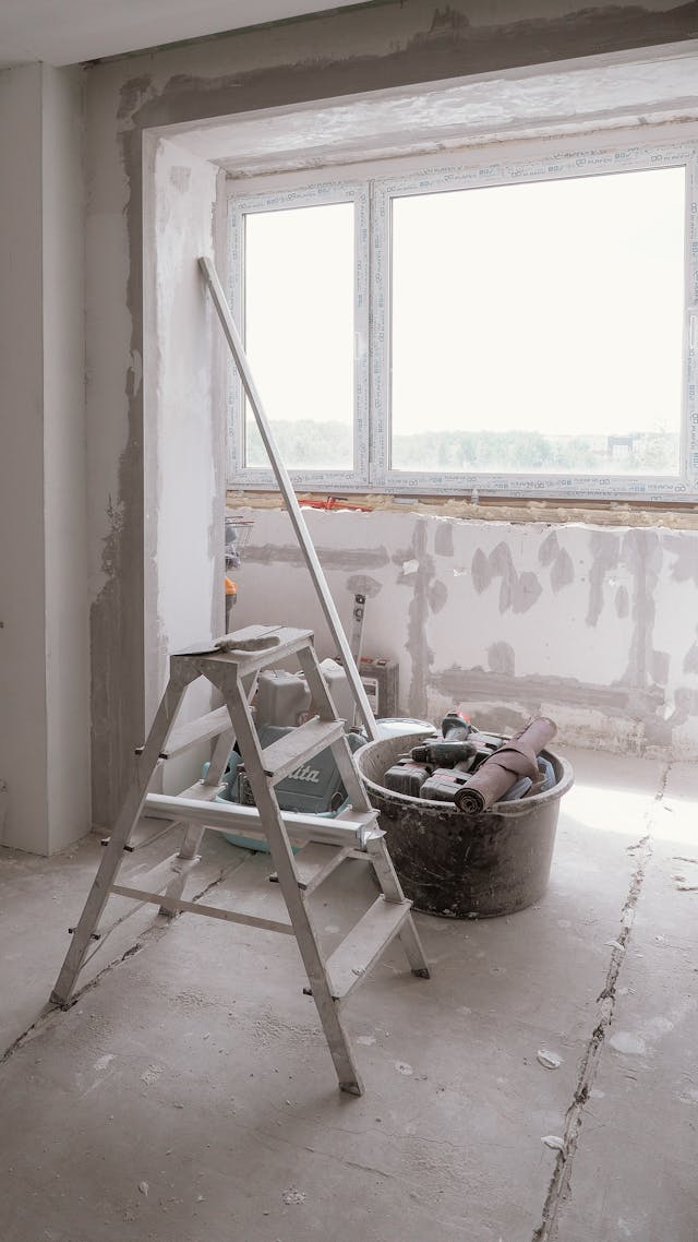 Ladder inside a building during a structural property renovation. Image via Pexels