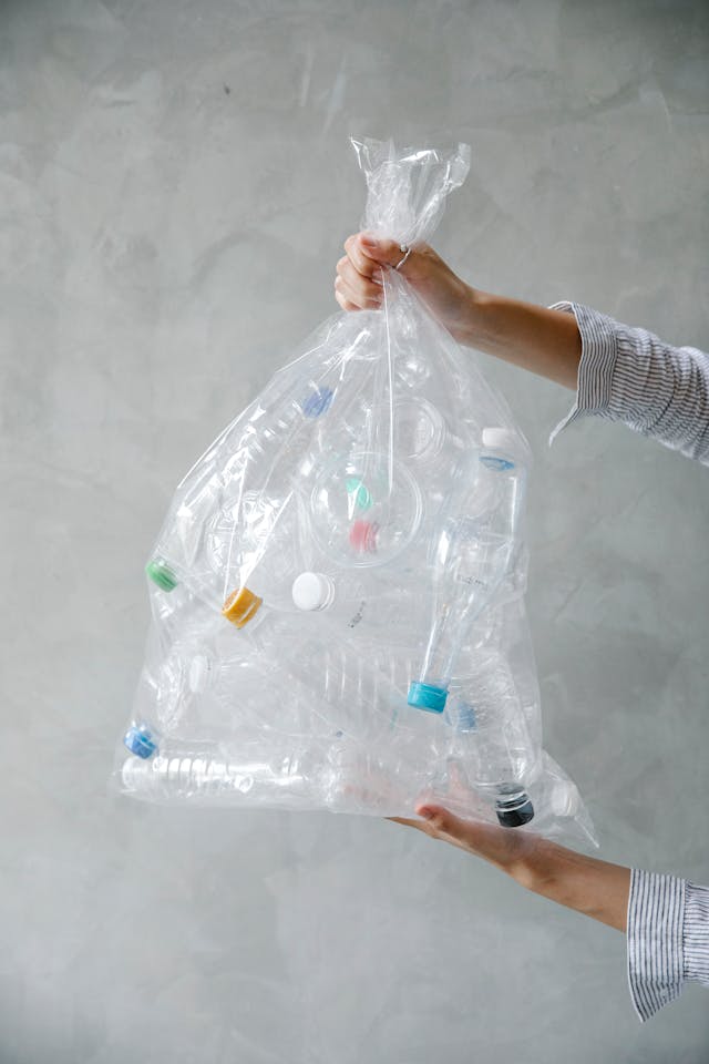 clear bag with lots of empty water bottles. Image by Pexels