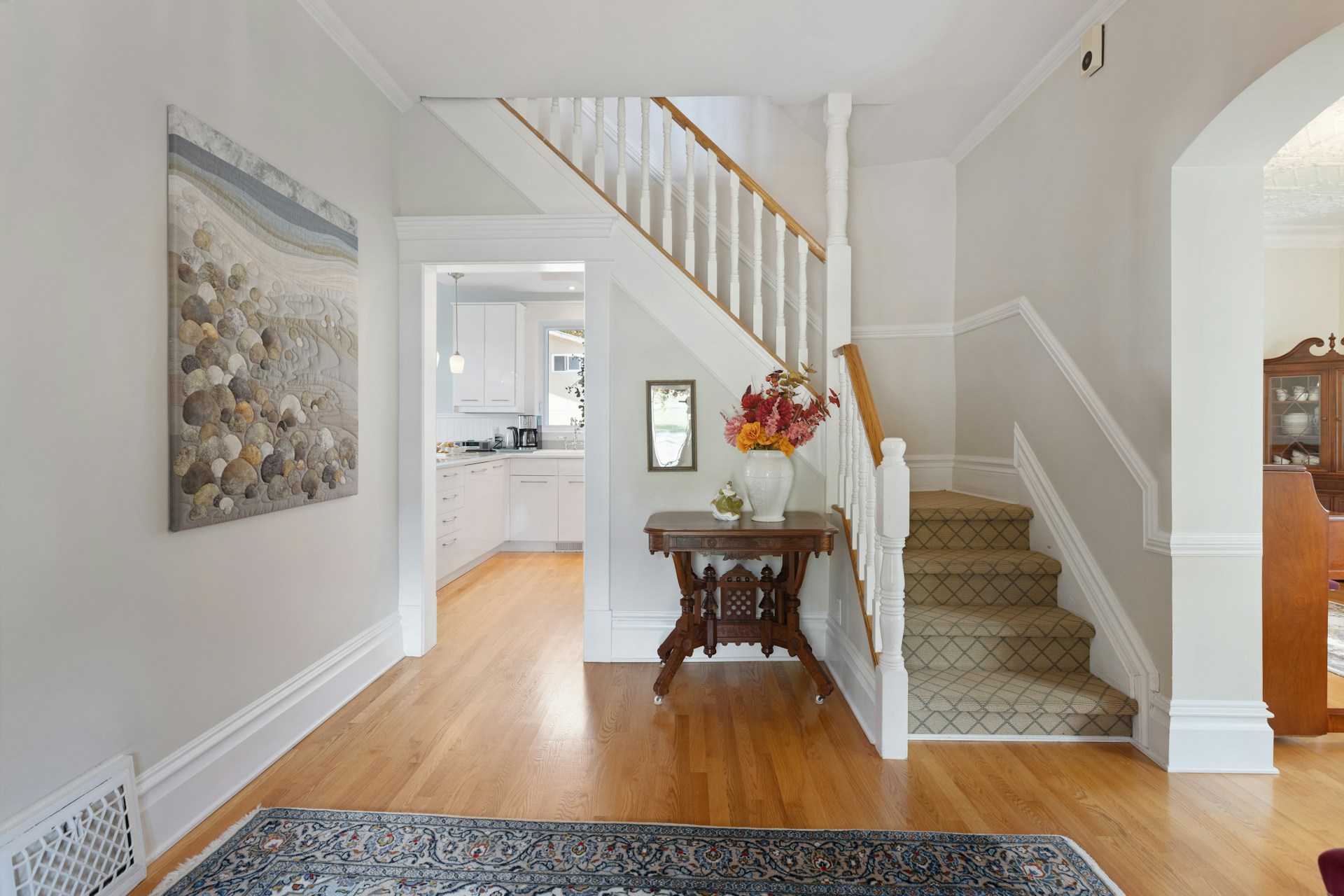 Interior of a compact apartment showing limited entryway storage space. Photo by Point3D Commercial Imaging Ltd. on Unsplash