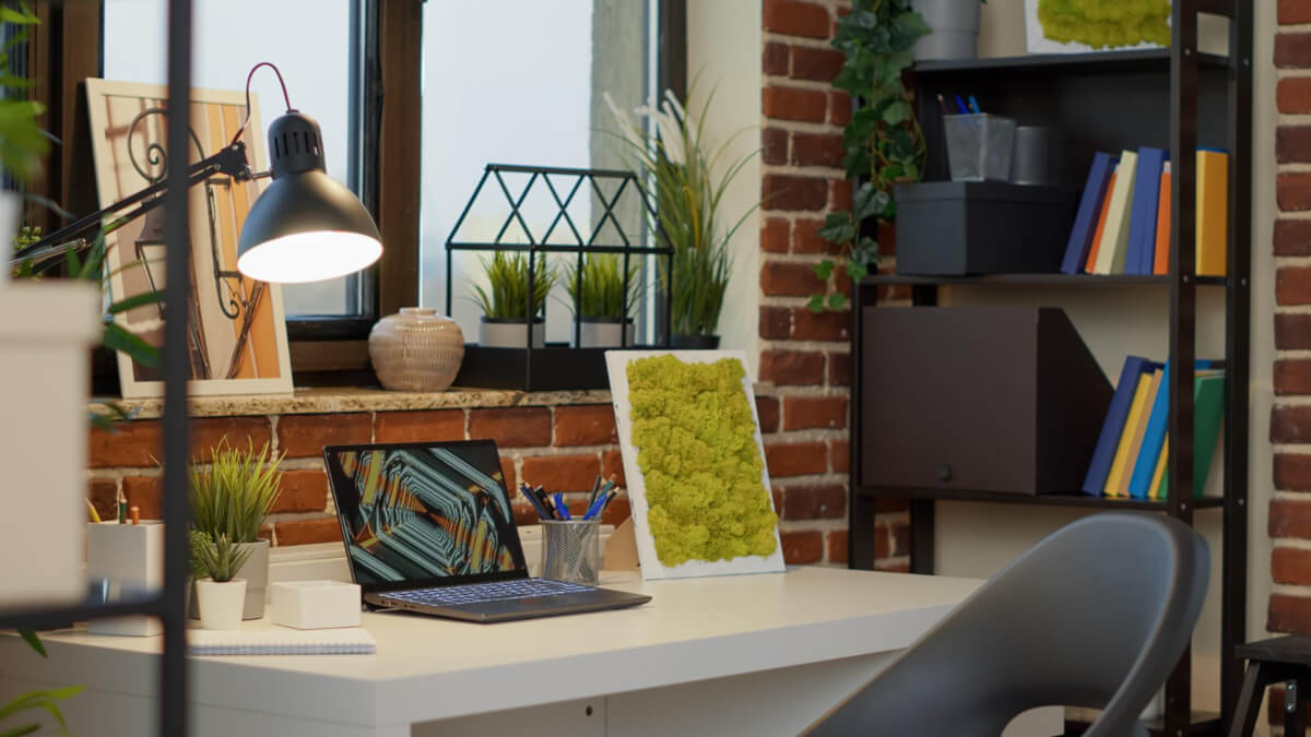 People working on laptops, sitting on beanbags. Image by Unsplash