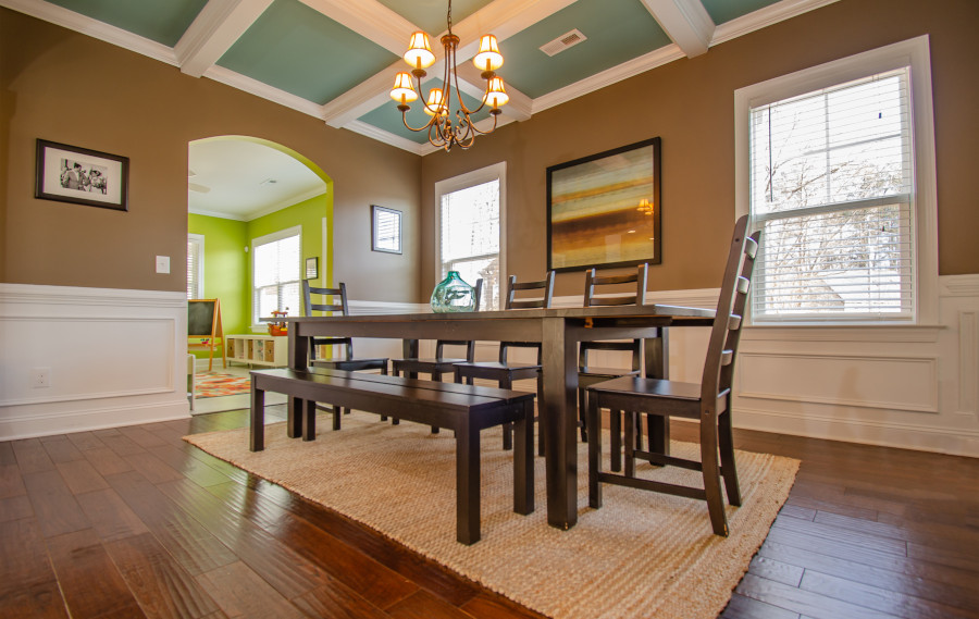 Diningroom with hardwood floors, brown walls and green ceiling