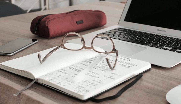 Notebook, glasses, laptop