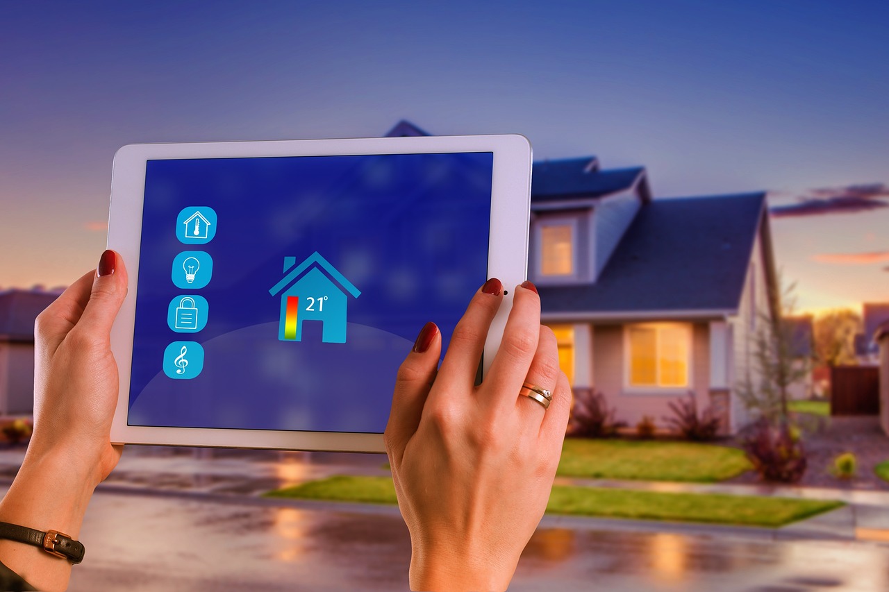 Smart Home, tablet in front of a house
