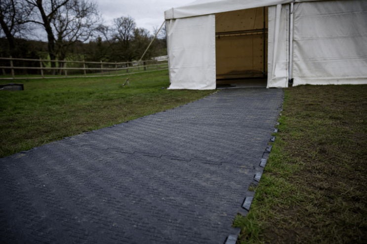 Large tent on a lawn.