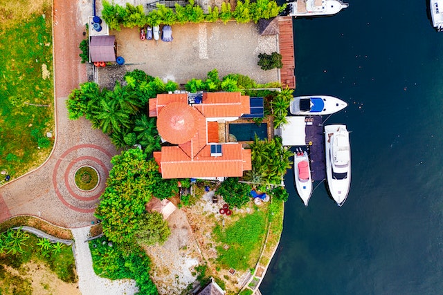 Arial view of waterfron house, boats in the water