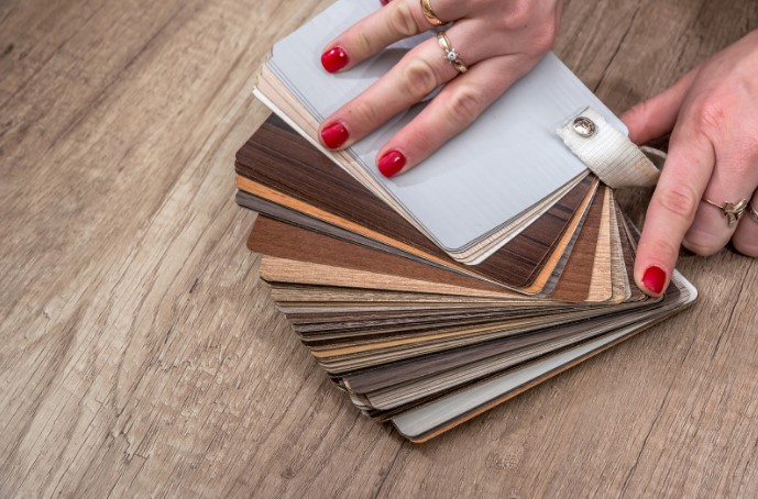 Color book, floorplans, eraser on a table. Image by Pexels