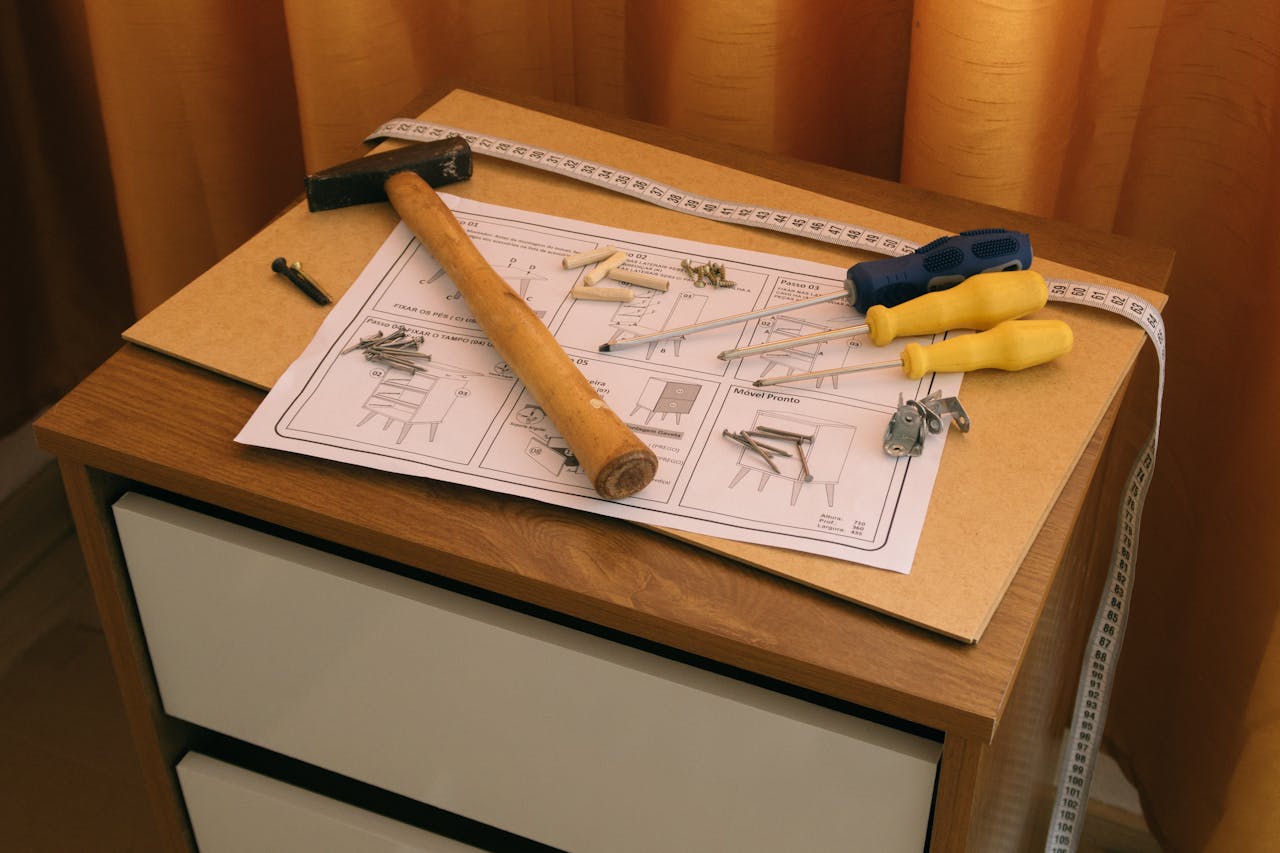 Furniture assembly instgructions and tools. Image by Pexels