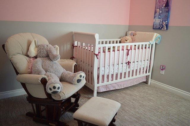 nursery, crib, chair with a stuffed elephant
