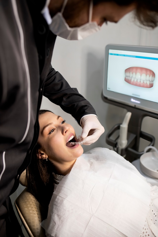 Orthodontist with patient. Image by Unsplash