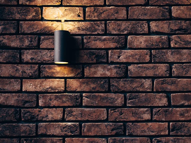 Brock wall woth a light. Image by Pexels