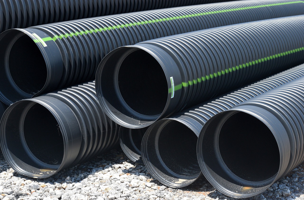 black drainage pipes, construction site. Image by Pixabay