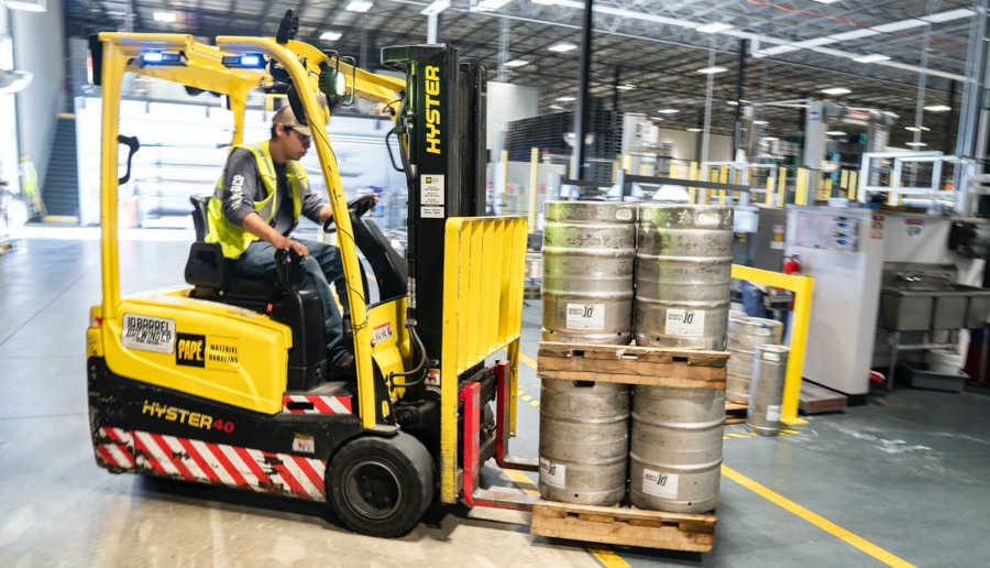 Person using a yellow forklift