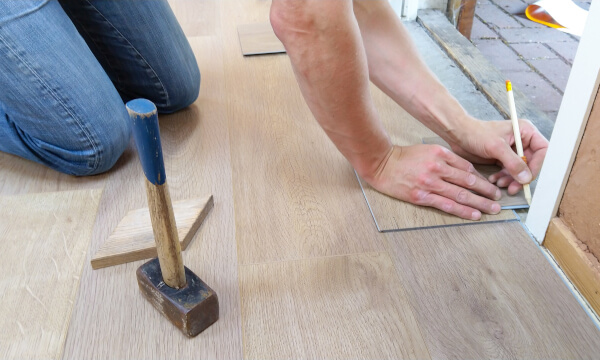 person putting in new flooring