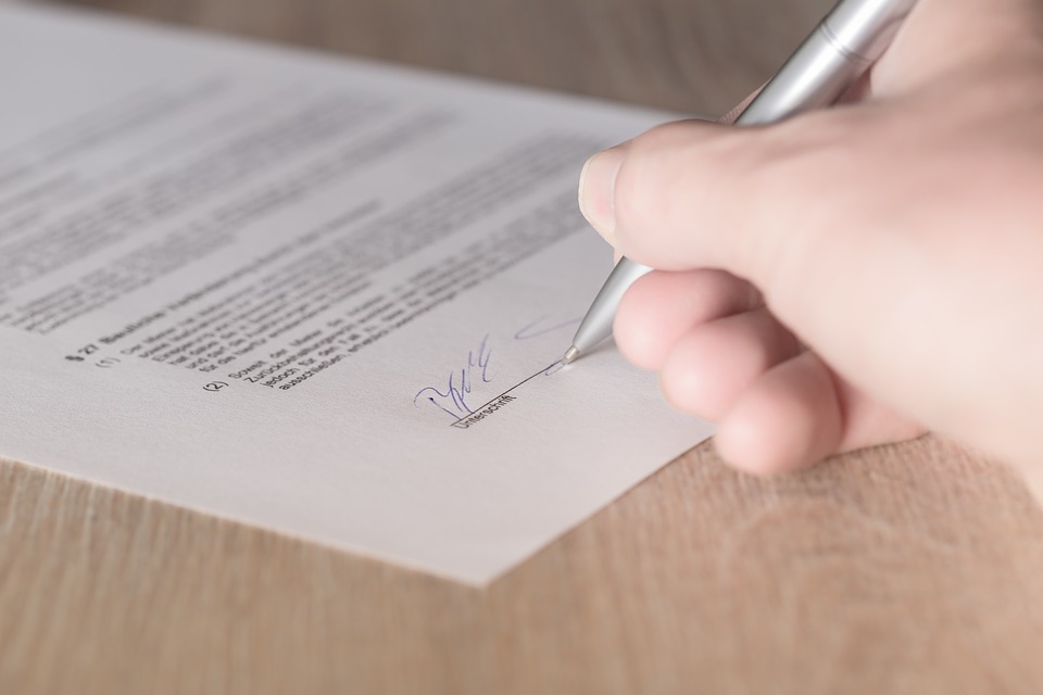 Person signing a contract