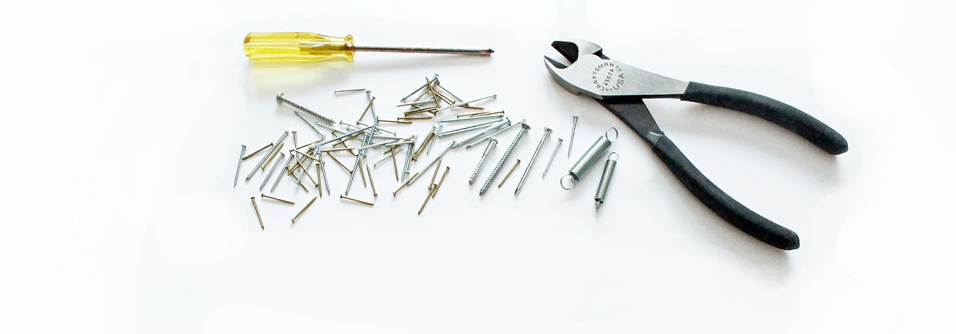 Yellow screwdriver, nails, tools