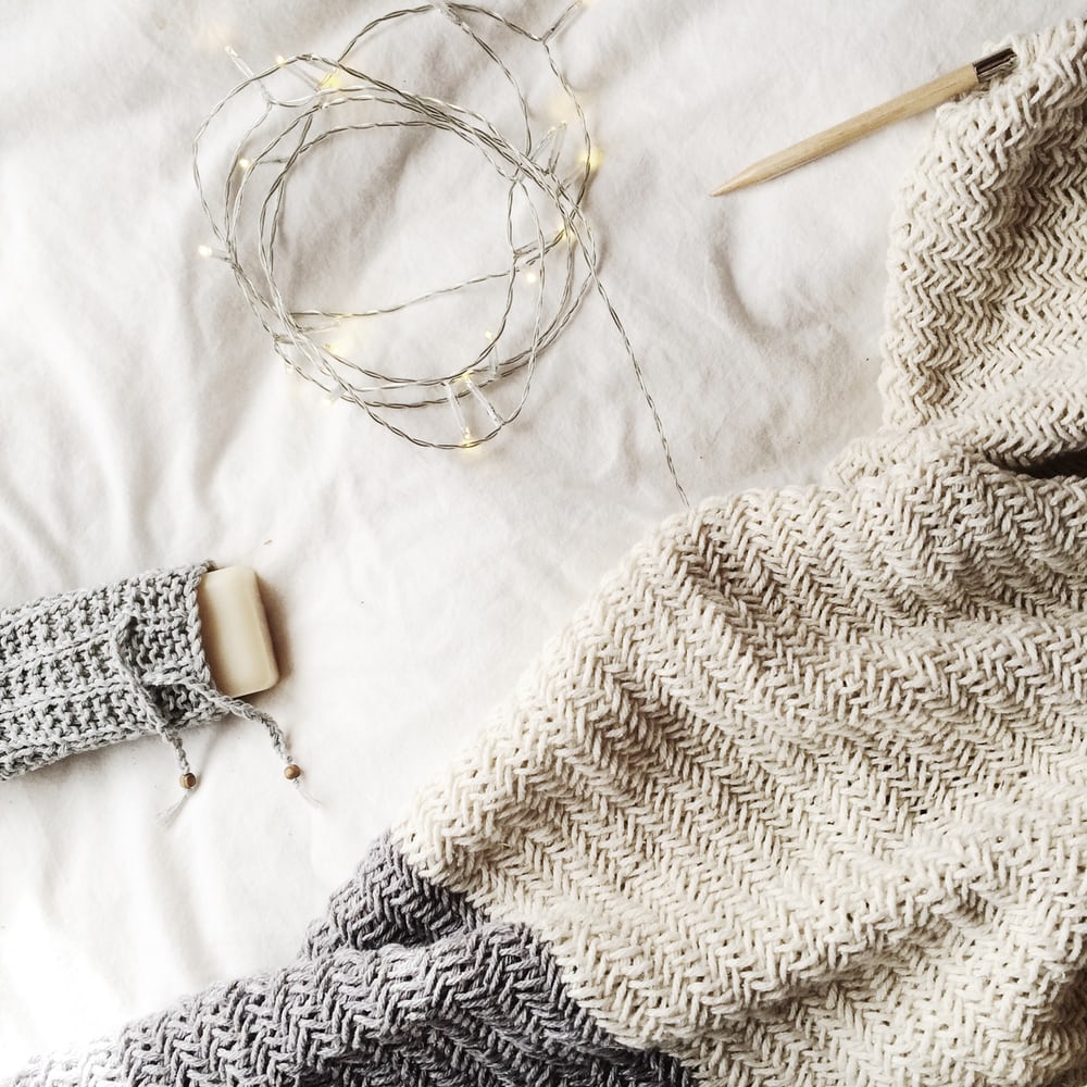 string light, knitted blanket