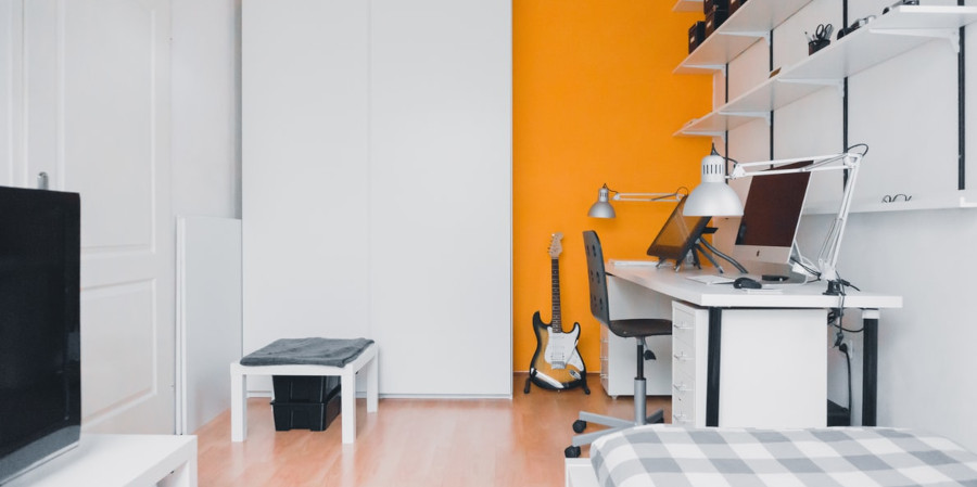 Bedroom with desk and tv