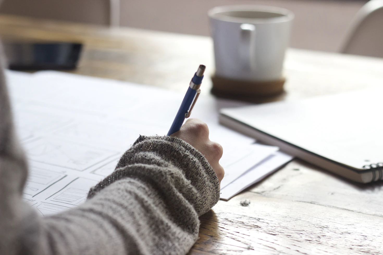 Person writing on a paper