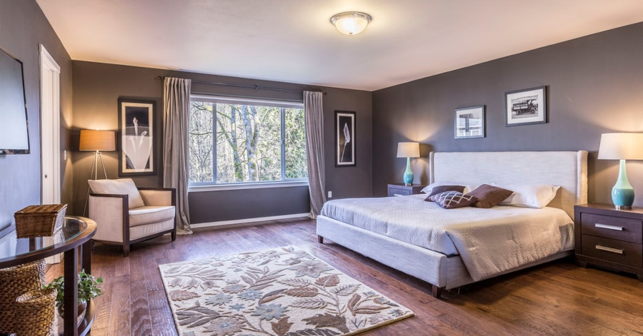 Bedroom. Bed with grey throw pillows