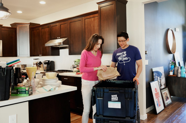 2 people sorting household stuff